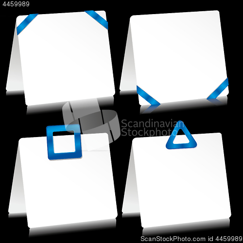 Image of Set of sheets of paper as note pads with  blue barrettes