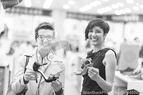 Image of best friend shopping in big mall