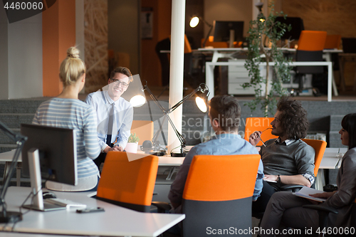 Image of Young Business Team At A Meeting at modern office building