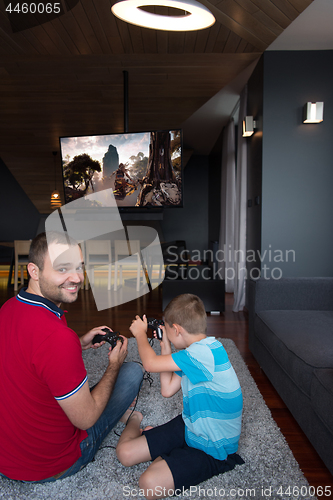 Image of Happy family playing a video game