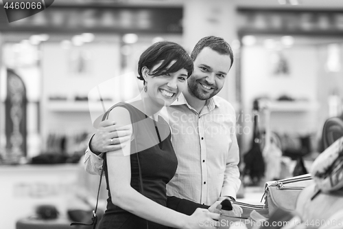 Image of couple chooses shoes At Shoe Store