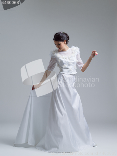 Image of Portrait of beautiful young women in wedding dress