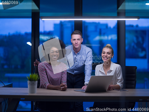 Image of Multiethnic startup business team in night office