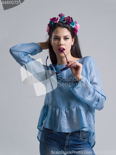 Image of woman posing in fashionable clothes and sunglasses
