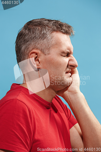 Image of Young man is having toothache.