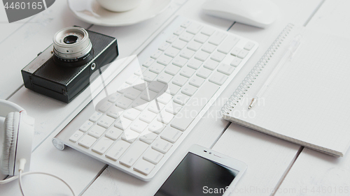 Image of Office gadgets and photo camera