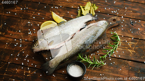 Image of Spices and lemon around fish