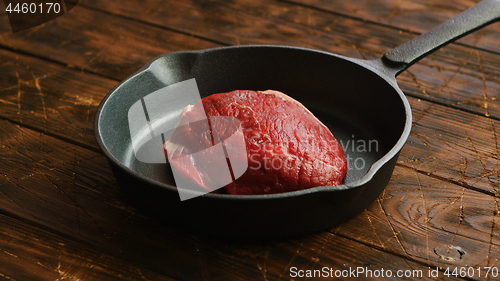 Image of Skillet with meat on table