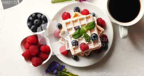 Image of Coffee and berries near waffles