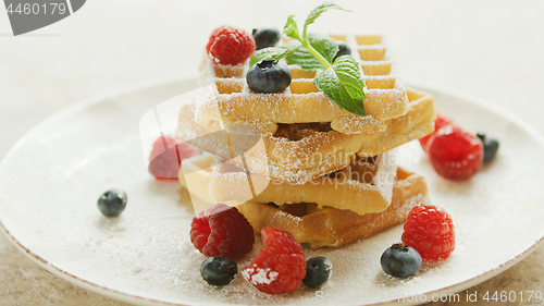 Image of Waffles served on plate with berries