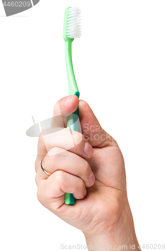 Image of Hand with toothbrush on white 