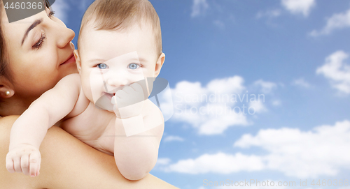 Image of mother with baby over sky background