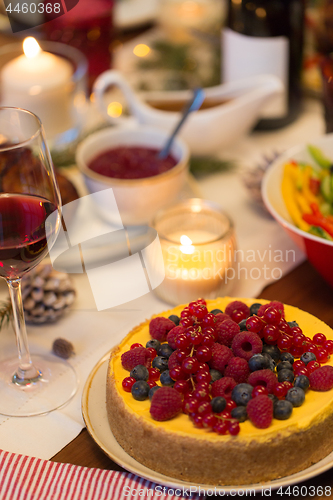 Image of close up of cake and other food on christmas table