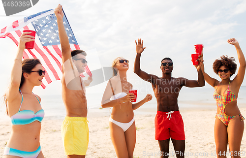 Image of friends at american independence day beach party