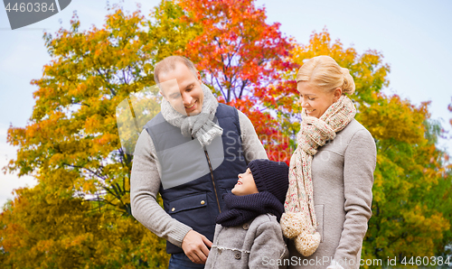 Image of happy family over autumn park background