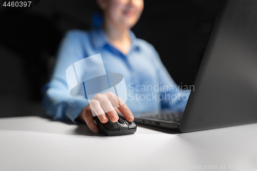 Image of close up of businesswoman using computer mouse