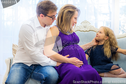 Image of Family portrait near christmas tree