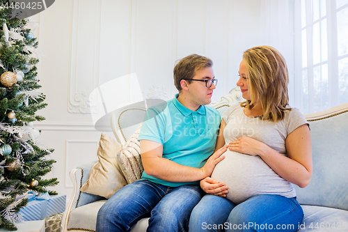 Image of Family portrait near christmas tree