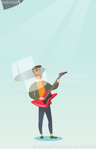 Image of Man playing the electric guitar.