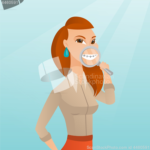 Image of Woman examining her teeth with a magnifier.