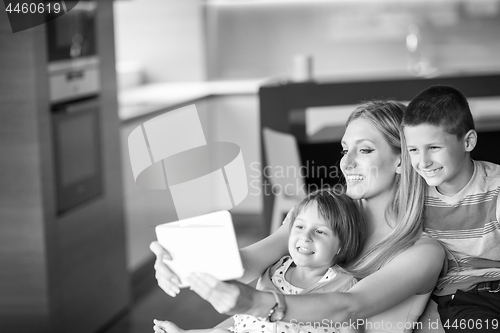 Image of Young Family Using A Tablet To Make Future Plans