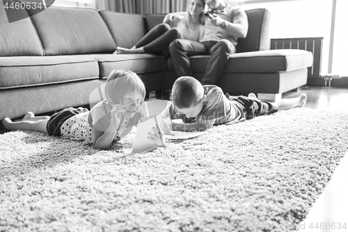 Image of young couple spending time with kids