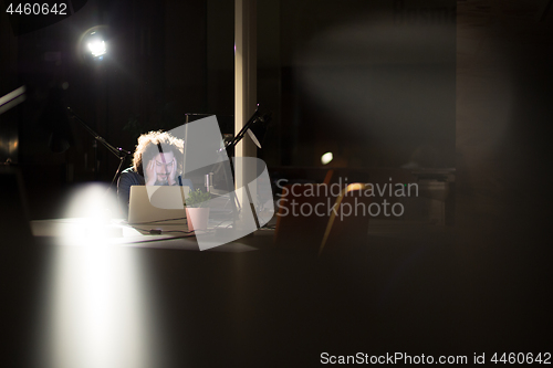 Image of businessman relaxing at the desk