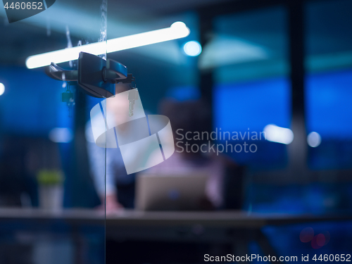 Image of Multiethnic startup business team in night office