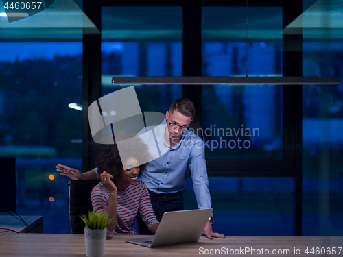 Image of Multiethnic startup business team in night office
