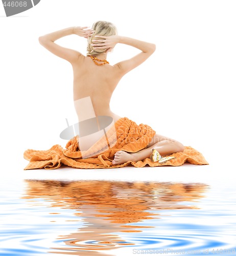 Image of beautiful lady with orange towels