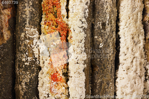 Image of salt crystals on wooden piles