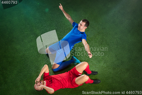 Image of Happy and unhappy football players after goal