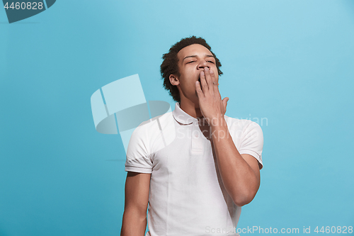 Image of Beautiful bored man bored isolated on blue background