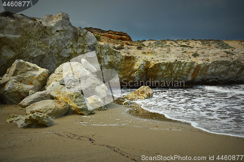 Image of beautiful beach with rock formations in Milos