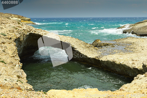 Image of natural rock bridge in Milos island