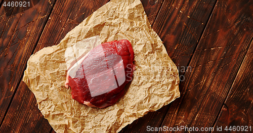 Image of Piece of raw meat on paper napkin