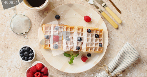 Image of Waffles served on plate with berries