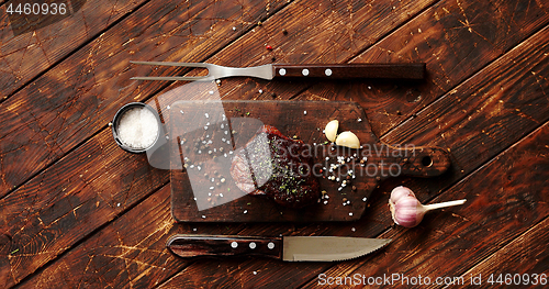 Image of Piece of meat on chopping board