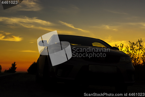 Image of Overnight stopover of traveling car on roadside at sunset