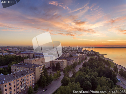 Image of Aerial lakeside cityscape view at golden hour after sunset