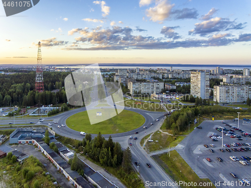 Image of Aerial view on road ring in city at summer sunset