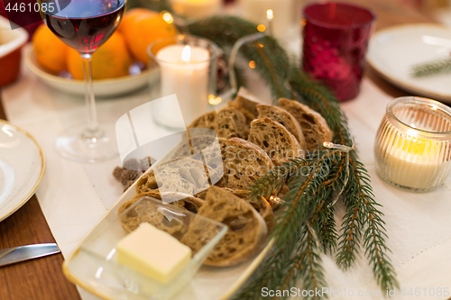 Image of bread slices and other food on christmas table