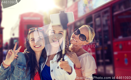 Image of group of smiling women taking selfie in london