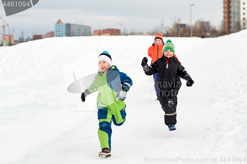 Image of happy little kids playing outdoors in winter