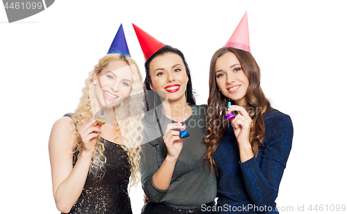 Image of happy women with party caps hugging