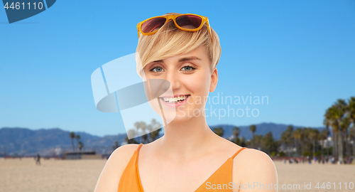 Image of portrait of smiling teenage girl over venice beach