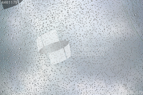 Image of water droplets on glass surface