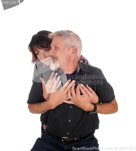 Image of Middle age couple embracing