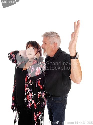 Image of Middle age couple fighting
