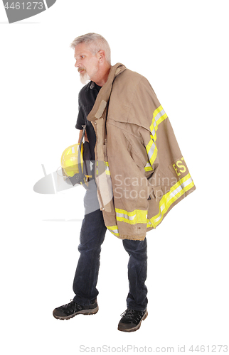 Image of A firefighter standing in profile 